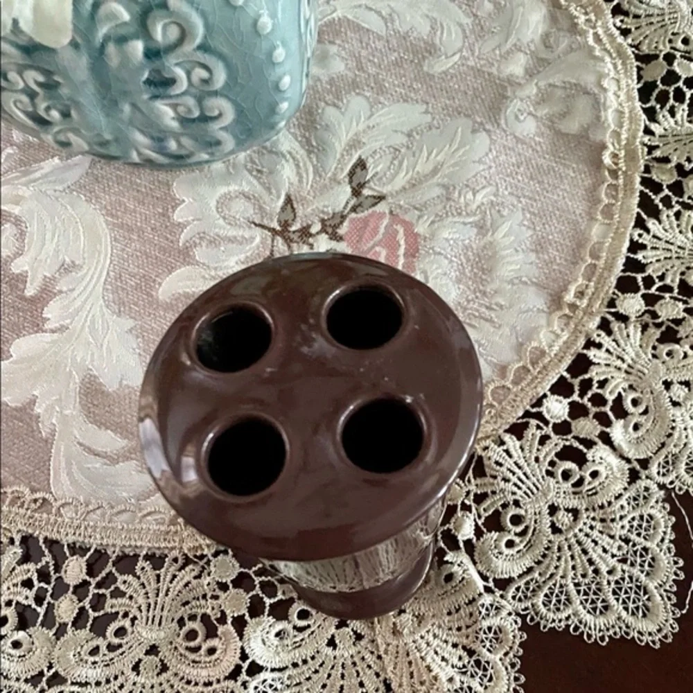 Chocolate‎ brown toothbrush holder.